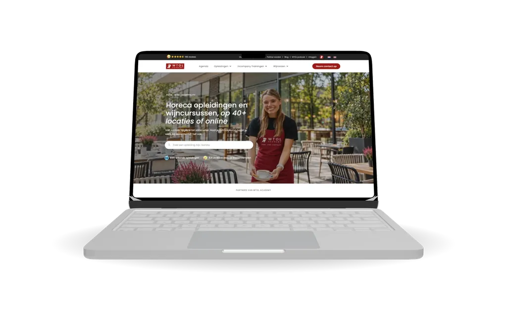 MacBook met de homepage van WTOL Academy, gemaakt door UPYOURBUSINESS